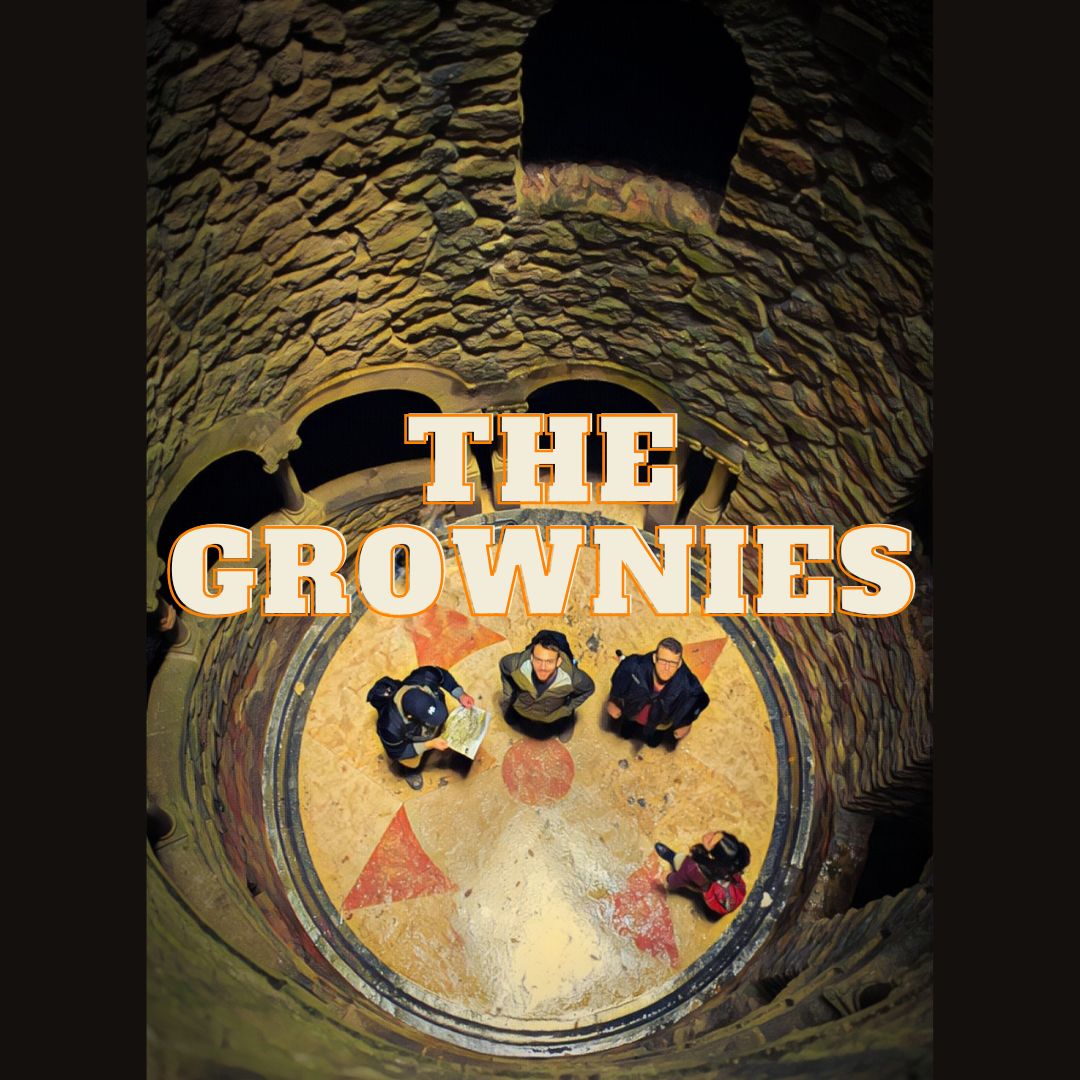 Poster for The Grownies: four people standing at the bottom of a tall cylindrical brick building with an external staircase, two people are looking up at the camera, one is reading a map, the other is looking ahead.